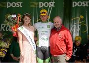 20 May 2015; Ryan Mullen, An Post Chain Reaction, after receiving the The Irish Sports Council U23 White Jersey Classification from Miss An Post Rás Siofra Loftus and Jimmy Murphy, Mayo Sports Partnership, following Stage 4 of the 2015 An Post Rás. Bearna - Newport. Photo by Sportsfile