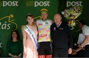 20 May 2015; Ronan McLaughlin after receiving the Cuchulainn statue for the first county rider home in Stage 4 from Miss An Post Rás Siofra Loftus and Stephen Breheny, Breheny Cycles Westport, following Stage 4 of the 2015 An Post Rás. Bearna - Newport. Photo by Sportsfile