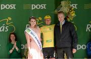 20 May 2015; Lukas Postlberger, Tirol Cycling Team, after receiving the An Post Rás Yellow Jersey Classification from Miss An Post Rás Siofra Loftus and Ger Dawson, Delivery Services Manager, An Post, Westport, following Stage 4 of the 2015 An Post Rás. Bearna - Newport. Photo by Sportsfile
