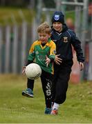 17 May 2015; Supporters Joey McManus, aged 6, from Ballinamore, Co. Leitrim, and Tiernan Burke, aged 11, from Kiltimagh, Co. Mayo, practice their skills before the game. Connacht GAA Football Senior Championship, Quarter-Final, Leitrim v Galway. Páirc Sean Mac Diarmada, Carrick-on-Shannon, Co. Leitrim. Picture credit: Ray McManus / SPORTSFILE