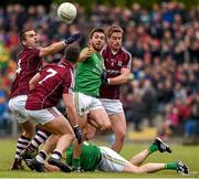 17 May 2015; Sean McWeeney, Leitrim, in action against Galway players, left to right, Cathal Sweeney, Seán Denvir and Gary O'Donnell. Connacht GAA Football Senior Championship, Quarter-Final, Leitrim v Galway. Páirc Sean Mac Diarmada, Carrick-on-Shannon, Co. Leitrim. Picture credit: Ray McManus / SPORTSFILE