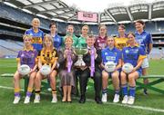 30 June 2008; Players representing counties involved in the TG4 All-Ireland Ladies Intermediate Championship with Geraldine Giles, Uachtaran Cumann Peil Gael na mBan, and Pol O'Gllchoir, Ceannasai, TG4, and the Mary Quinn Memiorial cup, back row, from left, Sandra Malone, Clare, Aisling Doonan, Cavan, Meadhbh Nash, Limerick, Vicki McEnery, representing Westmeath, Louise Tuly, Roscommon and Mairean Morrisey, Tipperary. Front row, from left, Margaret Kelly, Wexford, Andrea Murphy, Kilkenny, Alison Smith and Michelle McElvaney, Longford, at the TG4 All-Ireland Ladies Football Championship Launch, Croke Park, Dublin. Picture credit: Stephen McCarthy / SPORTSFILE