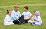 2 July 2008; Irish 3000m runner Roisin McGettigan with, from left, Lia Brady, 9, Cian May, 7, Ellie Brady,  6, and Caoimhe May, 5, at the Launch of Athletics Ireland Family Fitness Festival. Farmleigh, Phoenix Park, Dublin. For more information visit www.familyfitnessfestival.ie. Picture credit: Matt Browne / SPORTSFILE