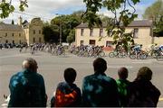 24 May 2015; A spectator's view of the peloton through the village of Naul during Stage 8 of the 2015 An Post Rás. Drogheda - Skerries. Photo by Sportsfile