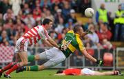 6 July 2008; Kieran Donaghy, Kerry, lays the ball off for team-mate Donnacha Walsh to score their side's goal, while being tackled by Cork goalkeeper Alan Quirke. GAA Football Munster Senior Championship Final, Kerry v Cork, Pairc Ui Chaoimh, Cork. Picture credit: Brendan Moran / SPORTSFILE