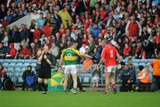 6 July 2008; Kerry's Darragh O'Se offers to shake hands with Cork's Pearse O'Neill as referee Derek Fahy looks on. GAA Football Munster Senior Championship Final, Kerry v Cork, Pairc Ui Chaoimh, Cork. Picture credit: Stephen McCarthy / SPORTSFILE