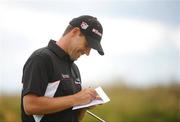 8 July 2008; Padraig Harrington marks his card after the 9th during the Ladbrokes.com Irish PGA Championship Pro Am Day. The European Club, Co. Wicklow. Picture credit: Brian Lawless / SPORTSFILE