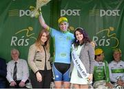 21 May 2015; Ian Richardson, UCD, after receiving the The One Direct County Jersey from Miss An Post Rás Donna McCaffrey and Averil Tyrrell, Marketing Executive, One Direct, following Stage 5 of the 2015 An Post Rás. Newport - Ballina. Photo by Sportsfile