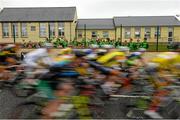 22 May 2015; Children from St. Lassara's National School, Ballinacarrow, Co. Sligo, cheer as the peloton passes during Stage 6 of the 2015 An Post Rás. Ballina - Ballinamore. Photo by Sportsfile