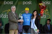 22 May 2015; Damien Shaw, Team Asea, after receiving the Cuchulainn statue for the first county rider home in Stage 6 from Miss An Post Sinead Flynn and Caothaoirleach of Leitrim County Council Paddy O'Rourke following Stage 6 of the 2015 An Post Rás. Ballina - Ballinamore. Photo by Sportsfile