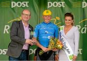 23 May 2015; Damien Shaw, Team Asea, after receiving the Cuchulainn statue for the first county rider home in Stage 6 from Miss An Post Rás Niamh Bidwell and Minister for Business and Employment, Ged Nash TD, following Stage 7 of the 2015 An Post Rás. Ballinamore - Drogheda. Photo by Sportsfile