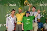 23 May 2015; Lukas Postlberger, Tirol Cycling Team, after receiving the An Post Rás Yellow Jersey Classification from Miss An Post Rás Niamh Bidwell, Simon McArdle, and Tom Maguire, Delivery Services Manager, An Post, Drogheda following Stage 7 of the 2015 An Post Rás. Ballinamore - Drogheda. Photo by Sportsfile