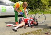 24 May 2015; Sean Featherstone, Newry Wheelers, is attended to after beng involved in an accident during Stage 8 of the 2015 An Post Rás. Drogheda - Skerries. Photo by Sportsfile