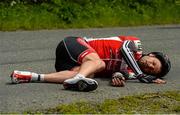 24 May 2015; Sean Featherstone, Newry Wheelers, lies on the ground after beng involved in an accident during Stage 8 of the 2015 An Post Rás. Drogheda - Skerries. Photo by Sportsfile