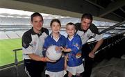 9 July 2008; The Vhi / GAA Cul Camps, the official GAA summer camps, got off to a flying start with the launch today of the Vhi Cul Camp Ambassadors. Cork Inter-county players and Vhi / GAA Cul Camp Ambassadors Daniel Goulding, football, left, and Cathal Naughton, hurling, with children who will take part in the Vhi / GAA Cul Camps. Picture credit: Pat Murphy / SPORTSFILE