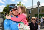 24 May 2015; Bryan McCrystal, Team Asea, gets a kiss from his daughter Eire, aged 6, after finishing Stage 8 of the 2015 An Post Rás. Drogheda - Skerries. Photo by Sportsfile