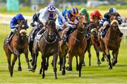 24 May 2015; Pleascach, centre left, with Kevin Manning up, ahead of Found, centre right, with Ryan Moore up, on their way to winning the Tattersalls Irish 1,000 Guineas. Curragh Racecourse, The Curragh, Co. Kildare. Picture credit: Cody Glenn / SPORTSFILE