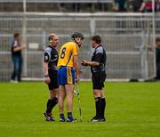 24 May 2015; linesman Sean Cleere, left, looks on as referee Colm Lyons speaks to Clare's Patrick Donnellan before issuing him a red card on the stroke of half time.  Munster GAA Hurling Senior Championship Quarter-Final, Clare v Limerick. Semple Stadium, Thurles, Co. Tipperary. Picture credit: Ray McManus / SPORTSFILE