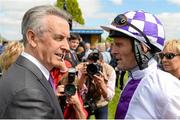 24 May 2015; Trainer Jim Bolger talks with Jockey Kevin Manning after Pleascach won  the Tattersalls Irish 1,000 Guineas. Curragh Racecourse, The Curragh, Co. Kildare. Picture credit: Cody Glenn / SPORTSFILE