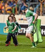 24 May 2015; The Limerick goalkeeper Barry Hennessy celebrates with young supporters Caiden Broderick, James Canty and David Geary, from Adare, after the game.  after the game. Munster GAA Hurling Senior Championship Quarter-Final, Clare v Limerick. Semple Stadium, Thurles, Co. Tipperary. Picture credit: Ray McManus / SPORTSFILE