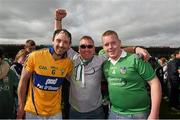 24 May 2015; Limerick's Paudie O'Brien, wearing a Clare jersey, celebrates with Limerick supporters Noel Copse and his son Kieran, from Ardagh, after the game. Munster GAA Hurling Senior Championship Quarter-Final, Clare v Limerick. Semple Stadium, Thurles, Co. Tipperary. Picture credit: Ray McManus / SPORTSFILE