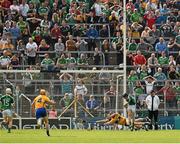 24 May 2015; Graeme Mulcahy, Limerick, shoots past the Clare corner back Domhnall O'Donovan and goalkeeper Patrick Kelly to score a goal in the 52nd minute. Munster GAA Hurling Senior Championship Quarter-Final, Clare v Limerick. Semple Stadium, Thurles, Co. Tipperary. Picture credit: Ray McManus / SPORTSFILE