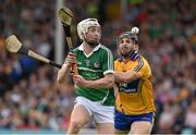 24 May 2015; Cian Lynch, Limerick, in action against Domhnall O'Donovan, Clare. Munster GAA Hurling Senior Championship Quarter-Final, Clare v Limerick. Semple Stadium, Thurles, Co. Tipperary. Picture credit: Ray McManus / SPORTSFILE