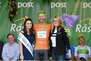 24 May 2015; Aidis Kruopis, An Post Chain Reaction, after receiving The LeasePlan Stage Jersey from Miss An Post Rás Aisling Halpin and Madeline McGovern, Operations Director, LeasePlan, following Stage 8 of the 2015 An Post Rás. Drogheda - Skerries. Photo by Sportsfile