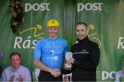 24 May 2015; Damien Shaw, Team Asea, after receiving the Cuchulainn statue for the first county rider home in Stage 8 from Stephen O'Sullivan following Stage 8 of the 2015 An Post Rás. Drogheda - Skerries. Photo by Sportsfile
