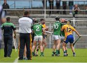 24 May 2015; Clare and Limerick players tussel with each other moments before half time. Referee Colm Lyons issued a red card to Patrick Donnellan shortly after and the Limerick captain Donal O'Grady, 10, was treated for an injury to the face. Munster GAA Hurling Senior Championship Quarter-Final, Clare v Limerick. Semple Stadium, Thurles, Co. Tipperary.  Picture credit: Ray McManus / SPORTSFILE