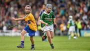 24 May 2015; Conor Hegarty, Kilnamona NS, Clare, in action against Liam Lynch, St Pauls NS, Limerick, during the half time Primary Go Games. Munster GAA Hurling Senior Championship Quarter-Final, Clare v Limerick. Semple Stadium, Thurles, Co. Tipperary. Picture credit: Ray McManus / SPORTSFILE