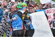 24 May 2015; Greg Callaghan, from Rathfarnham, Dublin, celebrates with father Stanley and partner Katy after winning the Chain Reaction Cycles Emerald Enduro, the 2nd Round of the 2015 Enduro World Series. County Wicklow. Picture credit: Ramsey Cardy / SPORTSFILE