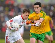17 May 2015; Emmet McNabb, Tyrone, in action against Philip Doherty, Donegal. Electric Ireland Ulster GAA Football Minor Championship, 1st Round, Donegal v Tyrone. MacCumhaill Park, Ballybofey, Co. Donegal. Picture credit: Oliver McVeigh / SPORTSFILE