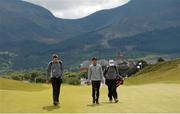 25 May 2015; Rickie Fowler, centre, walks down the first fairway during a practice round. Dubai Duty Free Irish Open Golf Championship 2015, Practice Day 1. Royal County Down Golf Club, Co. Down. Picture credit: Oliver McVeigh / SPORTSFILE