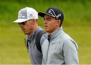 25 May 2015; Rickie Fowler, right, along with caddie Joe Skovron walking down the first fairway during a practice round. Dubai Duty Free Irish Open Golf Championship 2015, Practice Day 1. Royal County Down Golf Club, Co. Down. Picture credit: Oliver McVeigh / SPORTSFILE