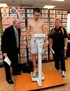 11 July 2008; Boxing Union of Ireland official Tony Lee, left, and trainer Harry Hawkins look on as Bernard Dunne checks his weight about 10 minutes before the official weigh-in ahead of the Hunky Dory's Fight Night this Saturday July 12th at the National Stadium, Dublin. Burlington Hotel, Dublin. Picture credit: Ray McManus / SPORTSFILE