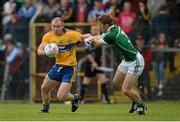 23 May 2015; Pat Burke, Clare, in action against Johnny McCarthy, Limerick. Munster GAA Football Senior Championship Quarter-Final, Clare v Limerick, Cusack Park, Ennis, Co. Clare. Picture credit: Brendan Moran / SPORTSFILE