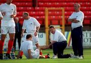 19 July 2000; Shelbourne manager Dermot Keely, right, watches as Stephen Geoghegan is attended to by physiotherapist Larry Byrne during the warm up prior to the UEFA Champions League First Qualifying Round Second Leg match between Shelbourne and Sloga Jugomagnat at Tolka Park in Dublin. Photo by Damien Eagers/Sportsfile