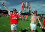 16 July 2000; Armagh's Kieran Hughes, left, and John McEntee celebrate with the Anglo-Celt cup following the Bank of Ireland Ulster Senior Football Championship Final between Armagh and Derry at St Tiernach's Park in Clones, Monaghan. Photo by Damien Eagers/Sportsfile