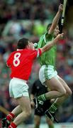 4 June 2000; Michael O'Connell of Cork in action against Ciaran Carey of Limerick during the Guinness Munster Senior Hurling Championship Semi-Final match between Cork and Limerick at Semple Stadium in Thurles, Tipperary. Photo by Ray McManus/Sportsfile