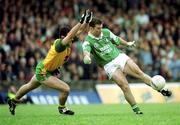 11 June 2000; Raymond Gallagher of Fermanagh in action against Mark Crossan of Donegal during the Bank of Ireland Ulster Senior Football Championship Quarter-Final match between Donegal and Fermanagh at MacCumhail Park in Ballybofey, Donegal. Photo by Ray Lohan/Sportsfile
