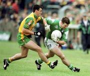11 June 2000; Raymond Gallagher of Fermanagh in action against Mark Crossan of Donegal during the Bank of Ireland Ulster Senior Football Championship Quarter-Final match between Donegal and Fermanagh at MacCumhail Park in Ballybofey, Donegal. Photo by Ray Lohan/Sportsfile