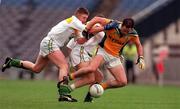 4 June 2000; Ronan Fitzsimons of Meath is tackled by Cathal Daly of Offaly during the Bank of Ireland Leinster Senior Football Championship Quarter-Final match between Offaly and Meath at Croke Park in Dublin. Photo by Damien Eagers/Sportsfile