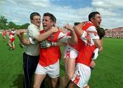 16 July 2000; Armagh players Gerard Houlahan, left, and Justin McNulty, right, celebrate following the Bank of Ireland Ulster Senior Football Championship Final between Armagh and Derry at St Tiernach's Park in Clones, Monaghan. Photo by Damien Eagers/Sportsfile