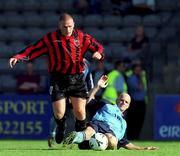 22 July 2000; Glen Crowe of Bohemians is tackled by Gareth Roberts of Tranmere Rovers during the Derek Swan Testimonial match between Bohemians and Tranmere Rovers at Dalymount Park in Dublin. Photo by David Maher/Sportsfile