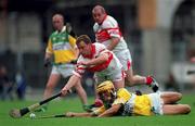 23 July 2000; Ger Oakley of Offaly in action against Kieran McKeever of Derry during the Guinness All-Ireland Senior Hurling Championship Quarter-Final match between Offaly and Derry at Croke Park in Dublin. Photo by Brendan Moran/Sportsfile