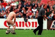 23 July 2000; West Ham United manager Harry Redknapp smiles after chasing after a streaker with a bottle of water during the Pre-Season Friendly match between St Patrick's Athletic and West Ham United at Richmond Park in Dublin. Photo by David Maher/Sportsfile