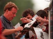 23 July 2000;  West Ham United manager Harry Redknapp signs autographs for supporters during the Pre-Season Friendly match between St Patrick's Athletic and West Ham United at Richmond Park in Dublin. Photo by David Maher/Sportsfile