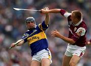 23 July 2000; John Leahy of Tipperary holds off the challenge of Vinnie Maher of Galway during the Guinness All-Ireland Senior Hurling Championship Quarter-Final between Tipperary and Galway at Croke Park in Dublin. Photo by Brendan Moran/Sportsfile