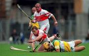 23 July 2000; Kieran McKeever of Derry in action against Ger Oakley of Offaly during the Guinness All-Ireland Senior Hurling Championship Quarter-Final match between Offaly and Derry at Croke Park in Dublin. Photo by Brendan Moran/Sportsfile
